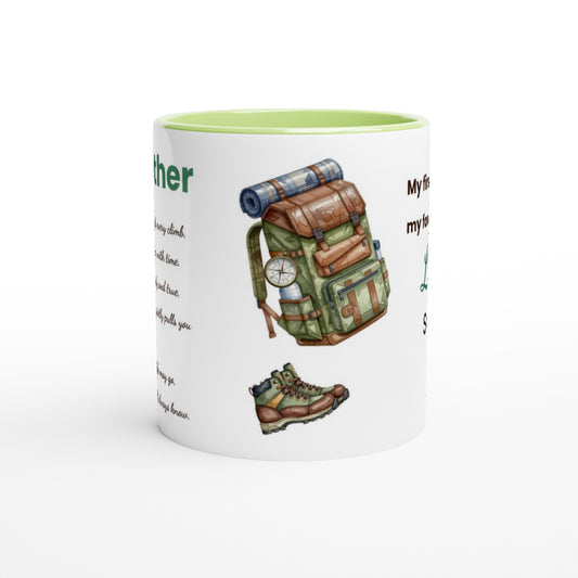 A white ceramic mug with a light green interior, decorated with a hiking backpack illustration, a hiking boot, and partial text on a white background.