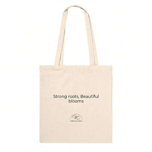 A natural canvas tote bag with black printed text and a small circular logo below