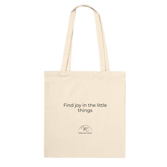 Back of natural coloured tote bag, with logo and quote " Find joy in the little things".