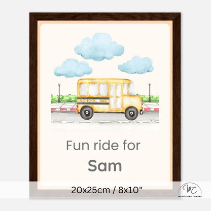 A dark wooden framed personalized children's wall art print featuring a watercolor-style yellow school bus under blue clouds, with the text 'Fun ride for Sam' and size text '20x25cm / 8x10"' at the bottom.