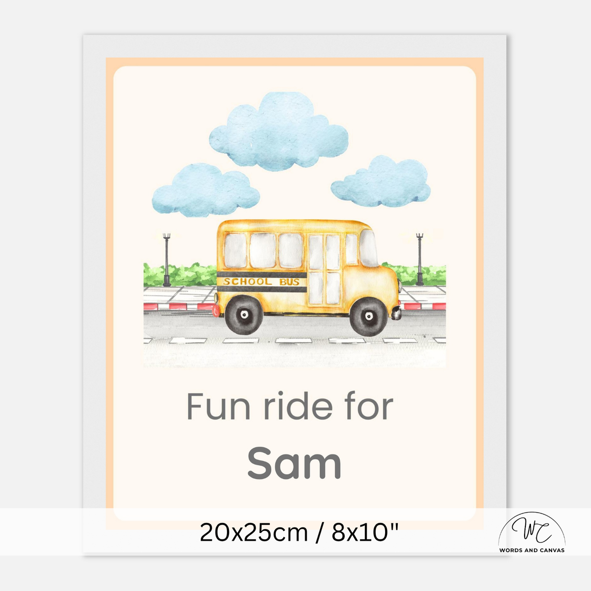 A personalized white framed children's school bus print featuring a watercolor-style yellow school bus under blue clouds, with the text 'Fun ride for Sam' and size information '20x25cm / 8x10"' shown below.