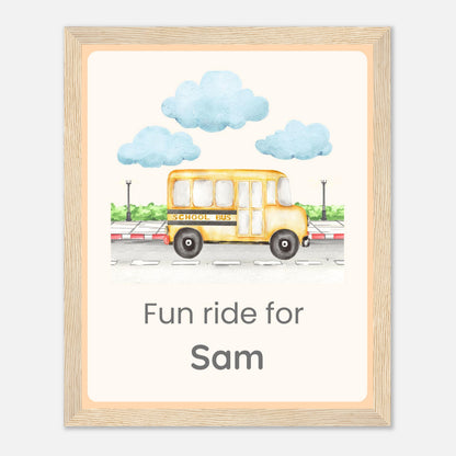 A personalized framed art print featuring a watercolor illustration of a yellow school bus with the text 'Fun ride for Sam' underneath, enclosed in a light wood frame.