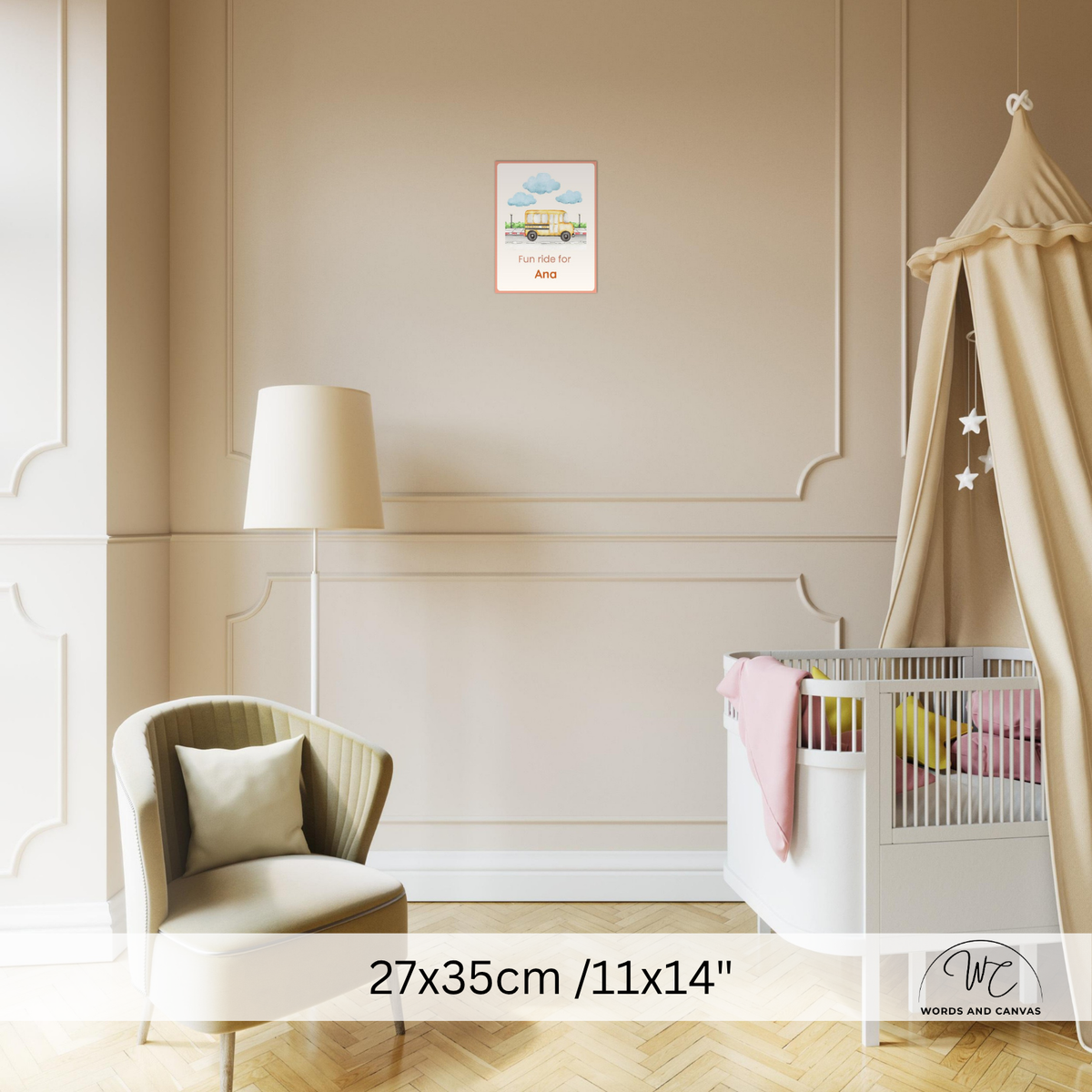 A framed personalized baby shower art print hangs on a beige wall in a styled nursery. The print features a colourful illustration of a baby carriage under a blue sky with clouds 