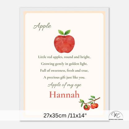 A personalized apple-themed nursery print or card featuring a watercolor red apple with green leaves, nursery rhyme text, and the name Hannah in red script. The print is shown centered on a light gray background with a size label at the bottom reading 27x35 cm / 11x14 inches.