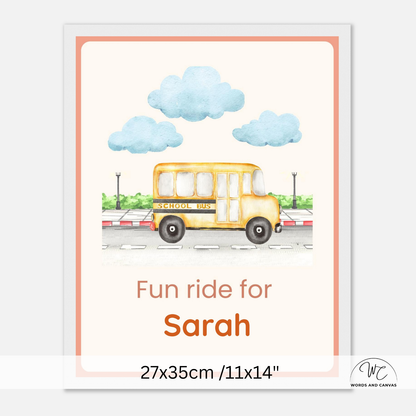 A personalized children's school bus print featuring a yellow bus, blue clouds, and the text 'Fun ride for Sarah' with dimensions '27x35cm /11x14"' shown below on a light gray background.
