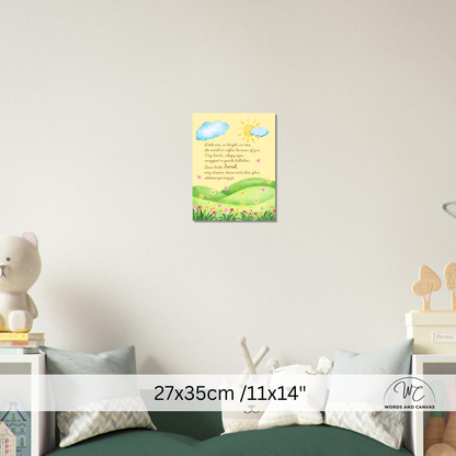 A small wall art print with a children's Bible verse and a colorful landscape illustration is displayed on a light gray wall above a bed. The print features a yellow sky with blue clouds and a sun, green hills, and pink flowers.