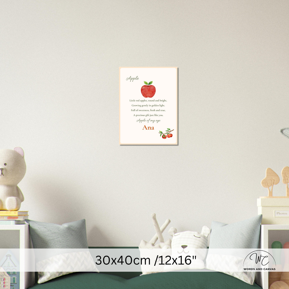 A personalized children's nursery wall art print featuring a red apple and a poem starting with 'Apple,' shown hanging on a light gray wall above a bed. The print includes the name 'Ana' at the bottom.