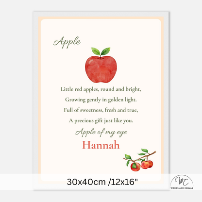 A personalized nursery print featuring a watercolor red apple with green leaves, a poem about apples, and the name 'Hannah' in red script. The print is shown with a white border and a size label at the bottom indicating 30x40cm /12x16".