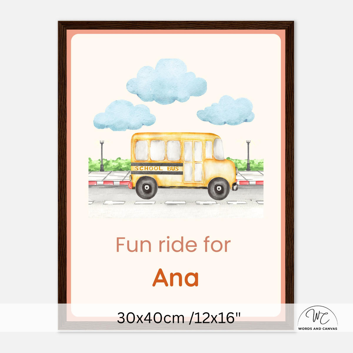 A personalized framed art print featuring a watercolor yellow school bus under blue clouds, with the text 'Fun ride for Ana' and size information '30x40cm /12x16"' at the bottom. The print is shown in a dark brown frame against a light gray background.