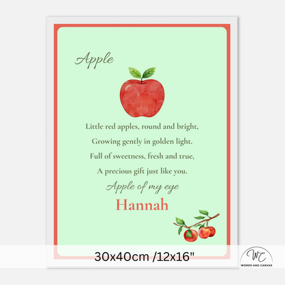 A personalized apple-themed nursery print with a light mint green background, a red watercolor apple illustration, and the text 'Apple of my eye' and 'Hannah'. The print is shown with a white frame and a size label at the bottom reading 30x40cm /12x16".