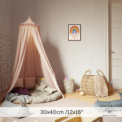 A pink canopy tent with sheer fabric draped over a padded floor bed in a styled children's room. A framed rainbow wall print hangs on the wall, with toys and a woven basket nearby.