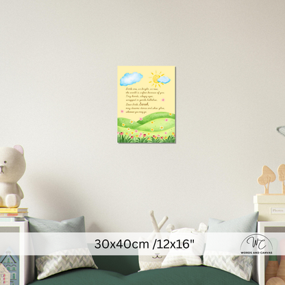 A children's nursery wall art print featuring a yellow sun, blue clouds, green hills, and a poem, displayed on a light gray wall above a green sofa in a styled room setting.
