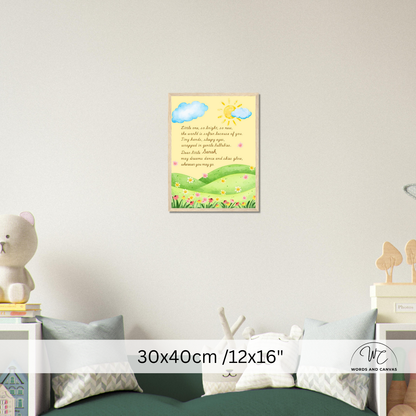 A framed children's wall art print hangs on a light gray wall above a green sofa in a styled room. The print shows a pastel landscape with blue clouds, a yellow sun, green hills, and a poem.