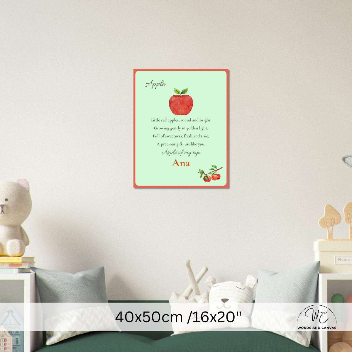 A personalized children's apple-themed nursery wall art print displayed on a light gray wall above a bed. The print features a red apple with green leaves on mint background, a poem about an apple, and the name 'Ana' in red script.