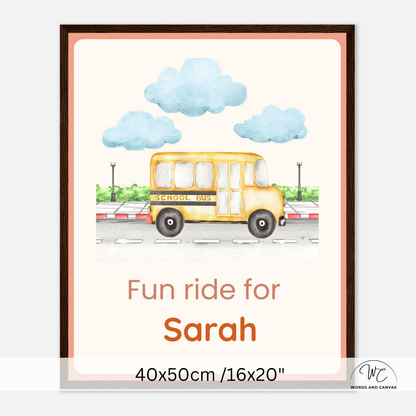 Personalized school bus children's room wall art with dark wooden frame  featuring a yellow school bus, blue clouds, and the text 'Fun ride for Sarah' with dimensions '40x50cm /16x20"' shown at the bottom.