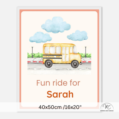 Personalized school bus print with a watercolor-style yellow school bus, blue clouds, and the text 'Fun ride for Sarah' on a cream background with a peach border. The print is shown with dimensions '40x50cm /16x20"' and a small 'Works and Canvas' logo in the corner.