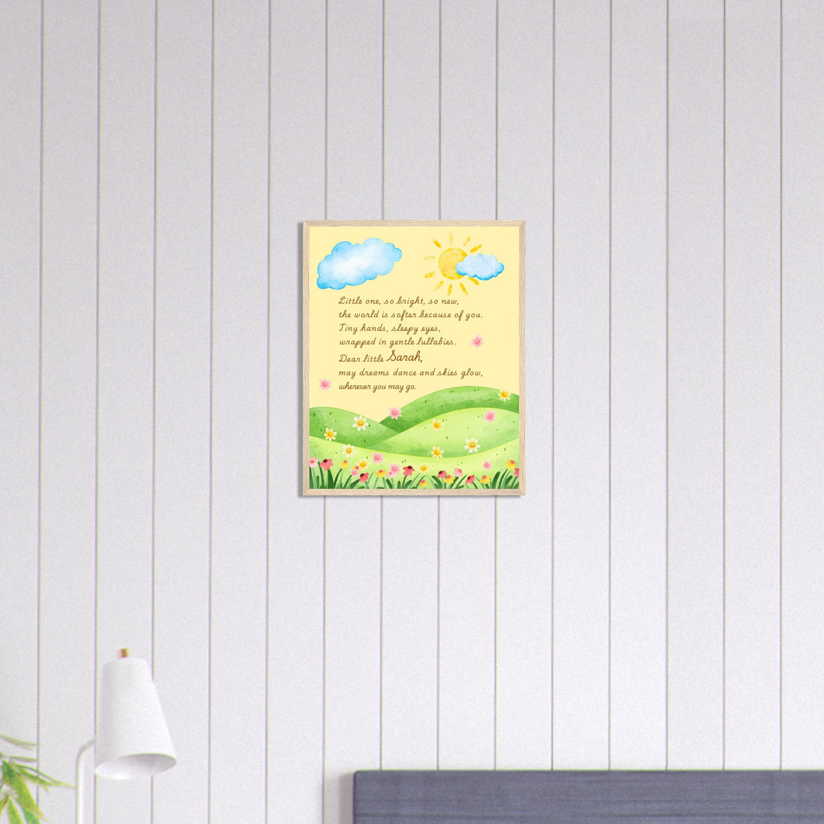 Framed artwork with a scenic design on a white paneled wall.