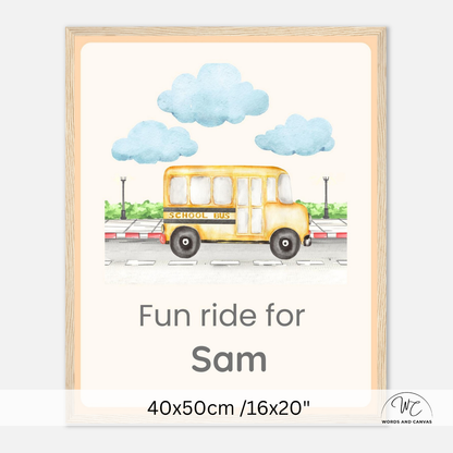 Personalized school bus canvas print in a light wood frame, featuring a yellow school bus, blue clouds, and the text 'Fun ride for Sam' with dimensions '40x50cm /16x20"' at the bottom.