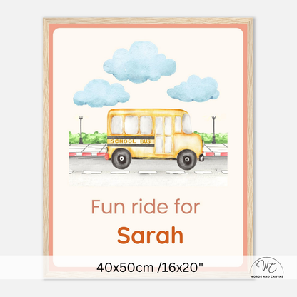 Personalized school bus children's wall art print with a yellow school bus illustration, blue clouds, and the text 'Fun ride for Sarah' on a cream background, shown with a light wood frame and size text at the bottom.