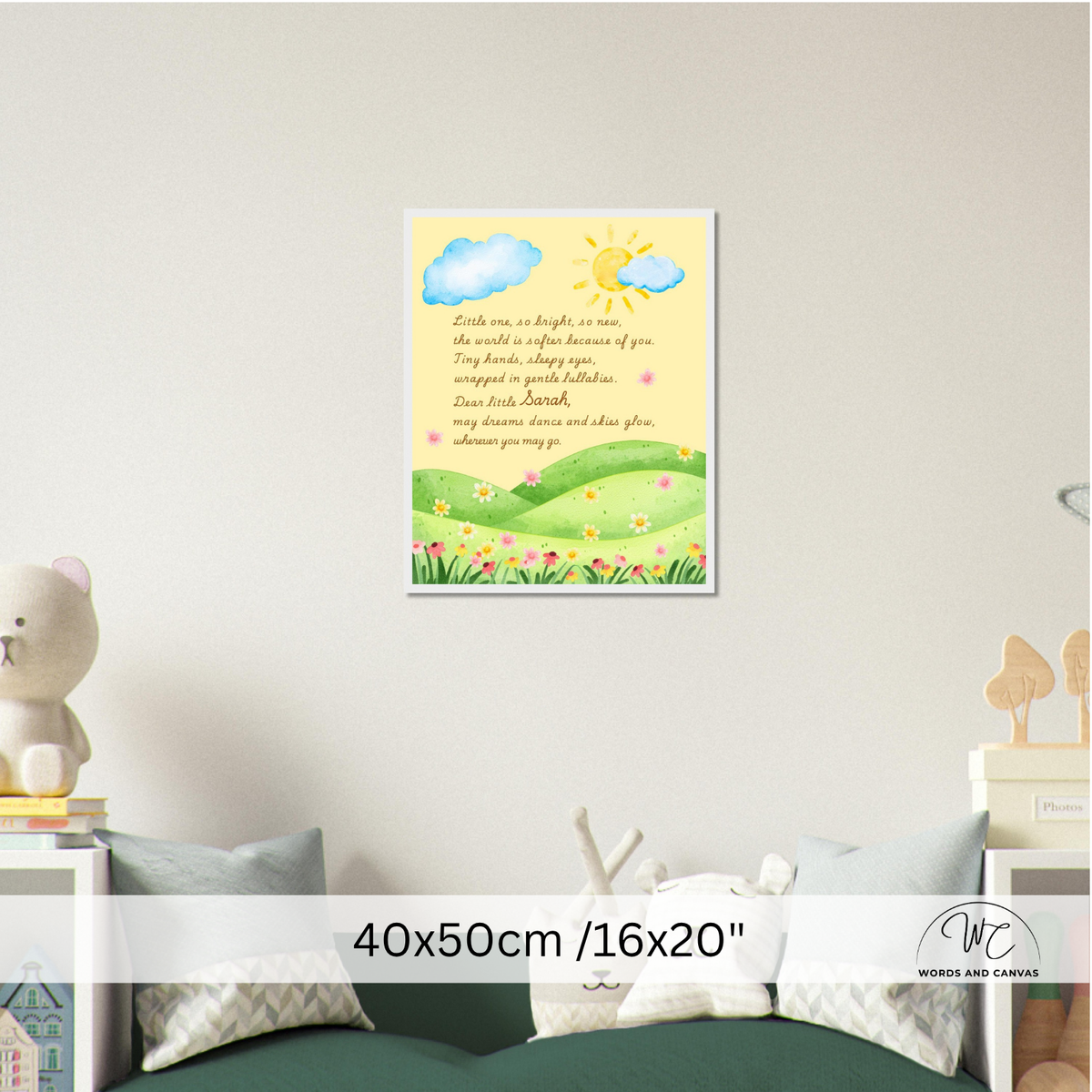 A framed wall art print featuring a yellow sky with blue clouds, a smiling sun, green rolling hills, and a flower meadow, displayed above a bed in a styled bedroom. 