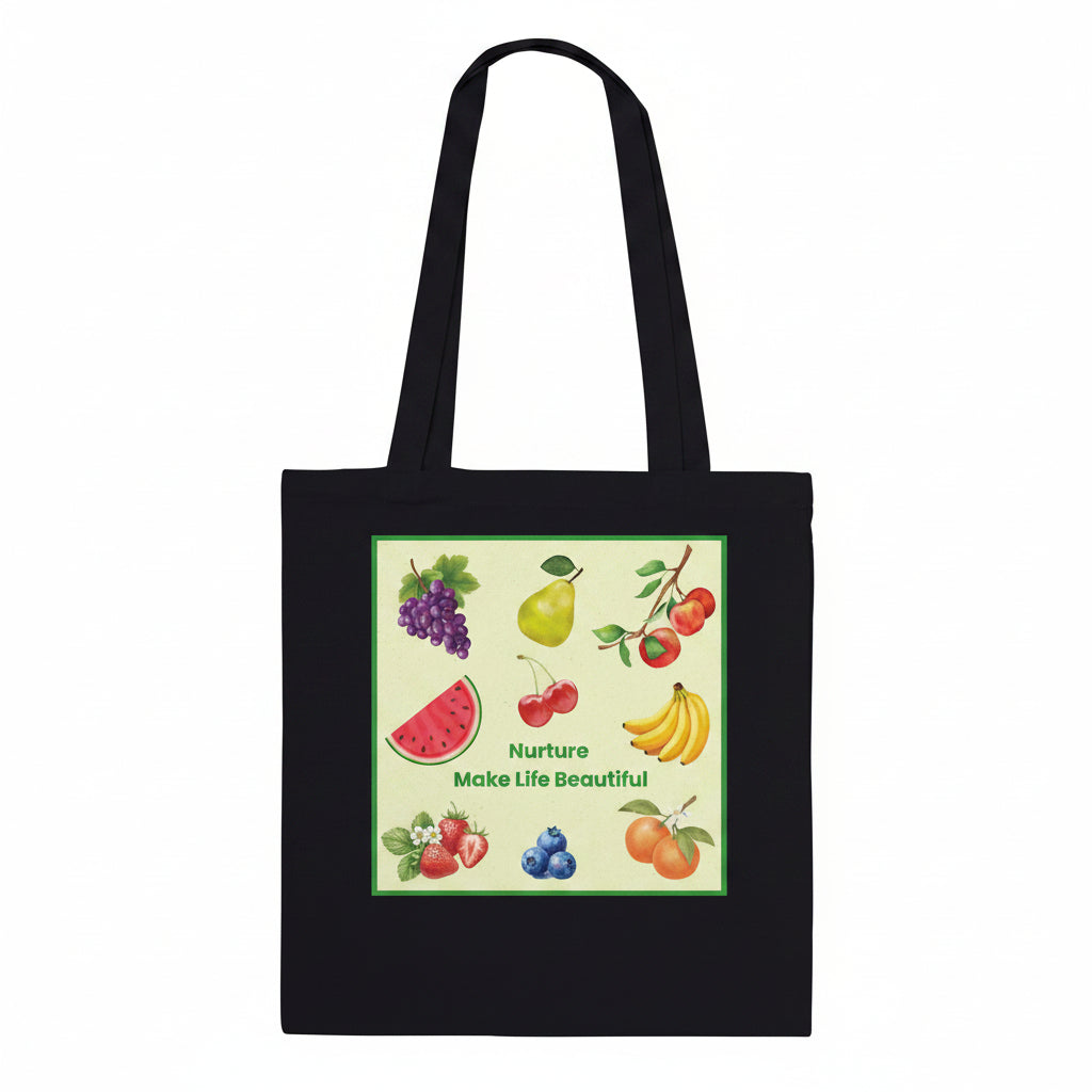 A black canvas tote bag with two shoulder straps, featuring a square graphic print on the front. The print showcases various colorful fruits, including grapes, a pear, cherries, watermelon, bananas, strawberries, blueberries, and oranges, with the text 'Nurture Make Life Beautiful' written in green.