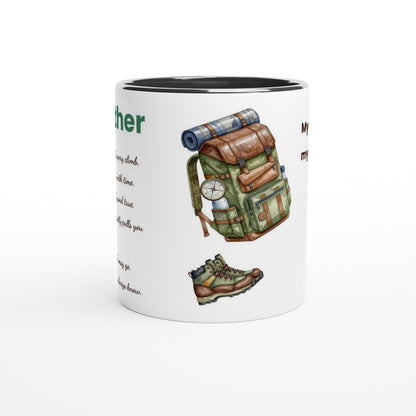 A white ceramic mug with a black interior, featuring a watercolor-style illustration of a green and brown hiking backpack, a hiking boot, a compass, and partial text on the side.