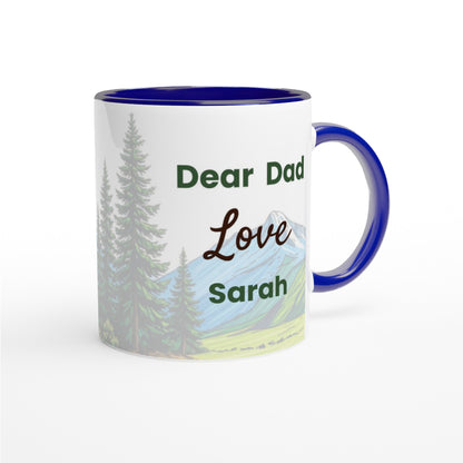 A white ceramic mug with a dark blue interior, handle, and rim, featuring a printed design of pine trees and mountains with the text 'Dear Dad Love Sarah'.