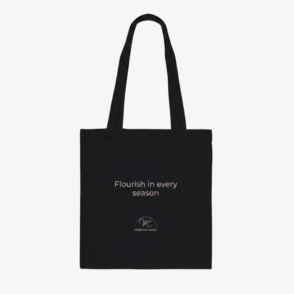 Black tote bag with personalised text on a white background