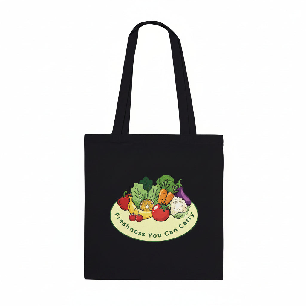 A black canvas tote bag with two shoulder straps, featuring a colorful graphic of fresh vegetables on a plate with the text 'Freshness You Can Carry' printed below it, set against a plain white background.
