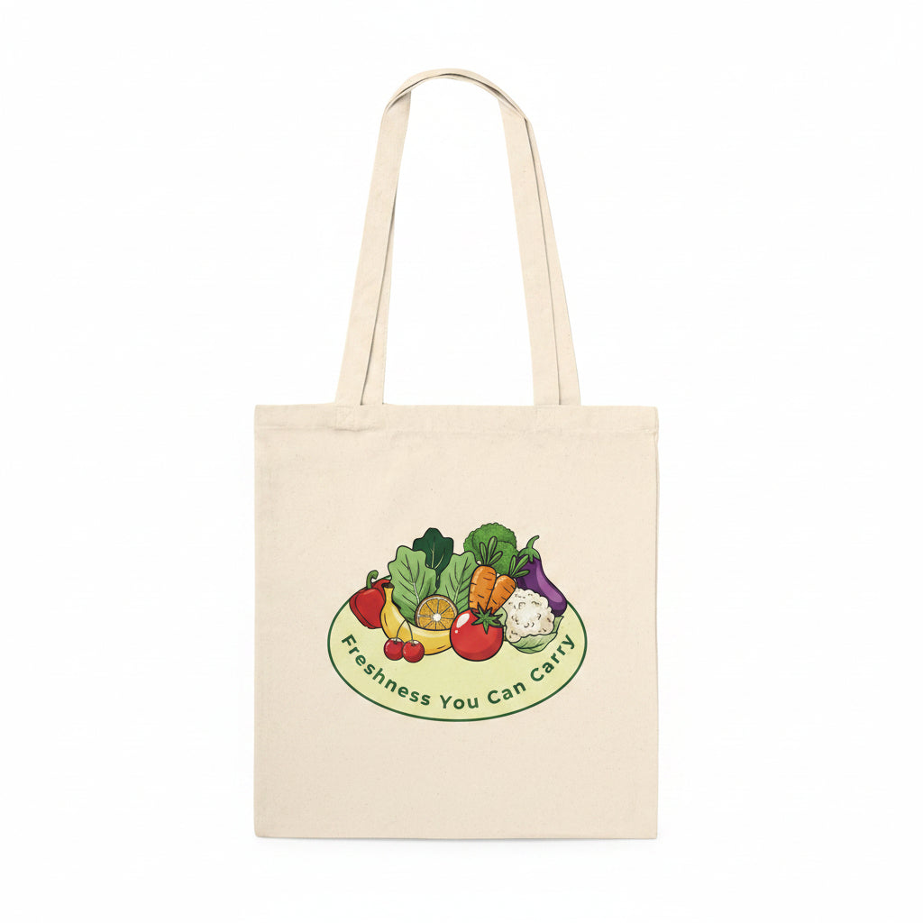 A natural canvas tote bag with dual shoulder straps, featuring a colorful graphic of fresh vegetables on a plate with the text 'Freshness You Can Carry' printed below it, set against a plain white background.