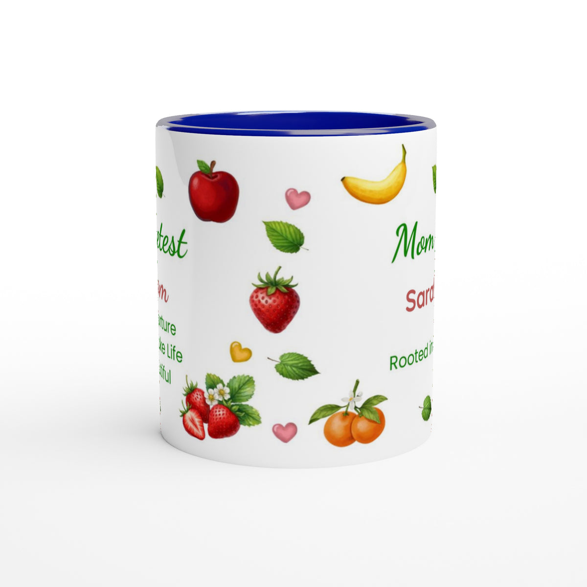 A white ceramic mug with a vibrant blue interior, decorated with illustrations of various fruits including strawberries, red apples, a banana, and oranges, alongside green text on a white background.
