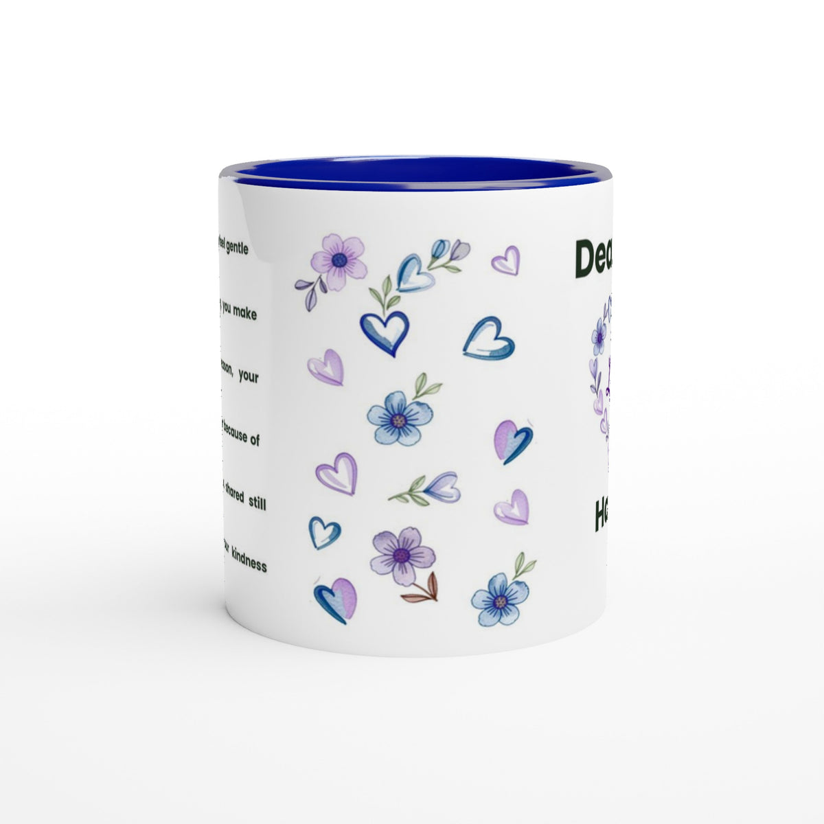 A white ceramic mug with a vibrant blue interior and rim, decorated with watercolor-style purple and blue flowers, hearts, and text on the side.