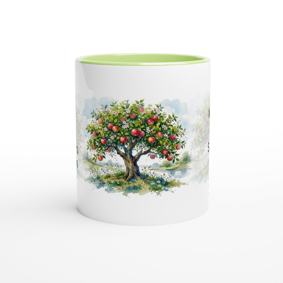A white ceramic mug with a light green interior, featuring a printed watercolor illustration of an apple tree with red apples on the front.