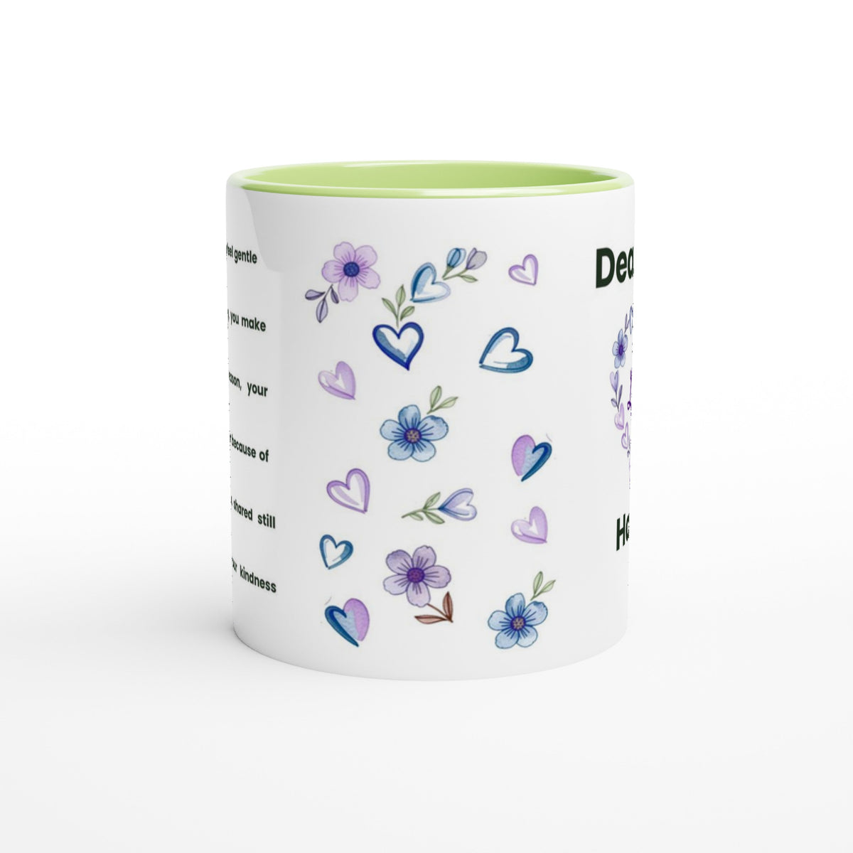 A white ceramic mug with a light green interior, decorated with purple and blue watercolor-style flowers, hearts, and text on the side, shown on a clean white background.