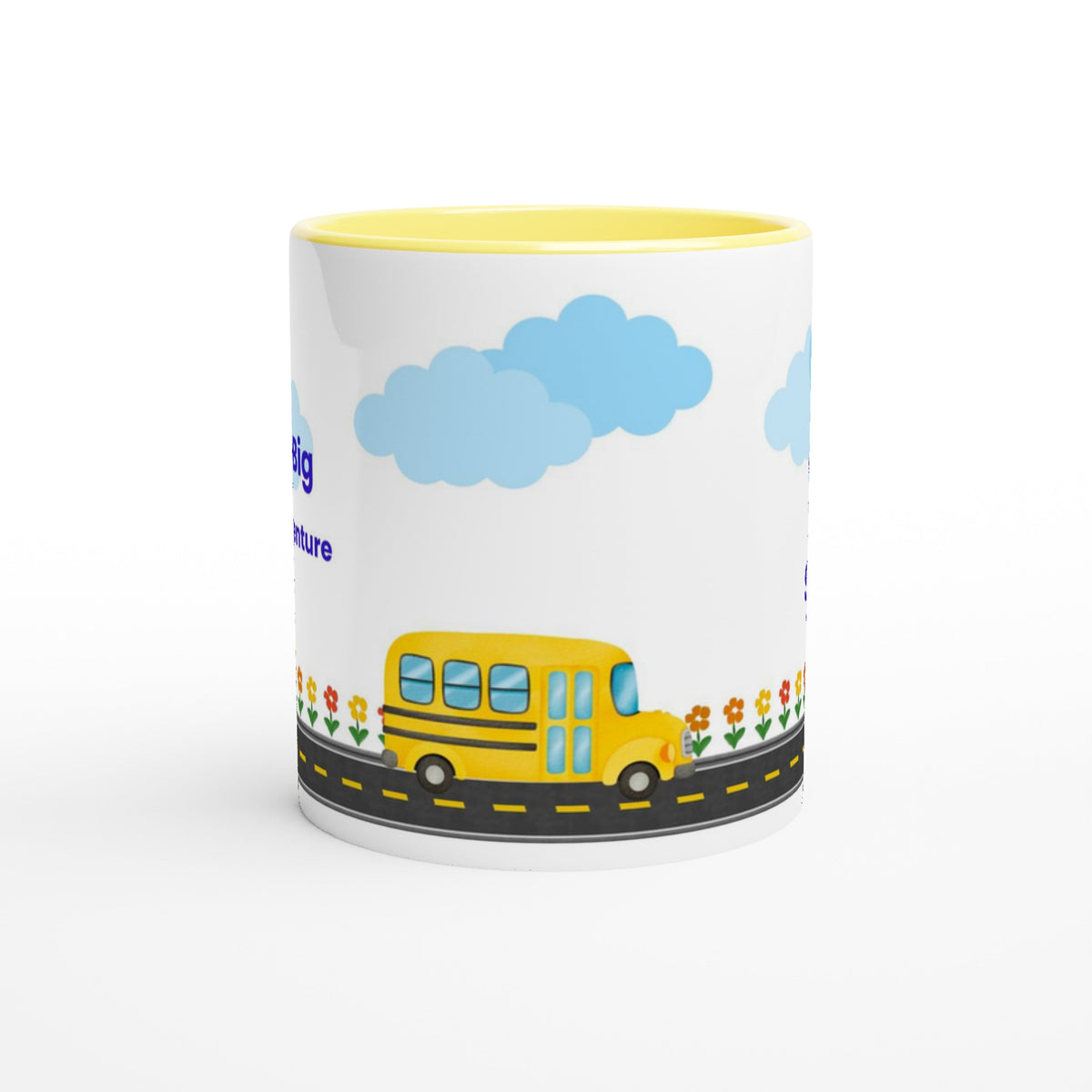 A white ceramic mug with a yellow interior, featuring a cartoon illustration of a yellow school bus on a road with blue clouds and flowers.