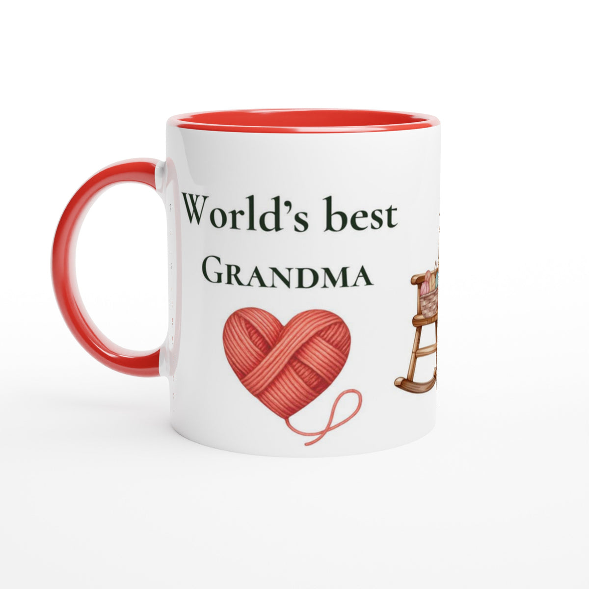 A white ceramic mug with a red interior and red handle, printed with the text 'World's best GRANDMA' above a red heart-shaped yarn ball and a small rocking chair illustration.