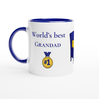A white ceramic mug with a dark blue interior, handle, and rim, featuring the printed text 'World's best GRANDAD' in blue above a gold medal graphic with '#1' on a white background.