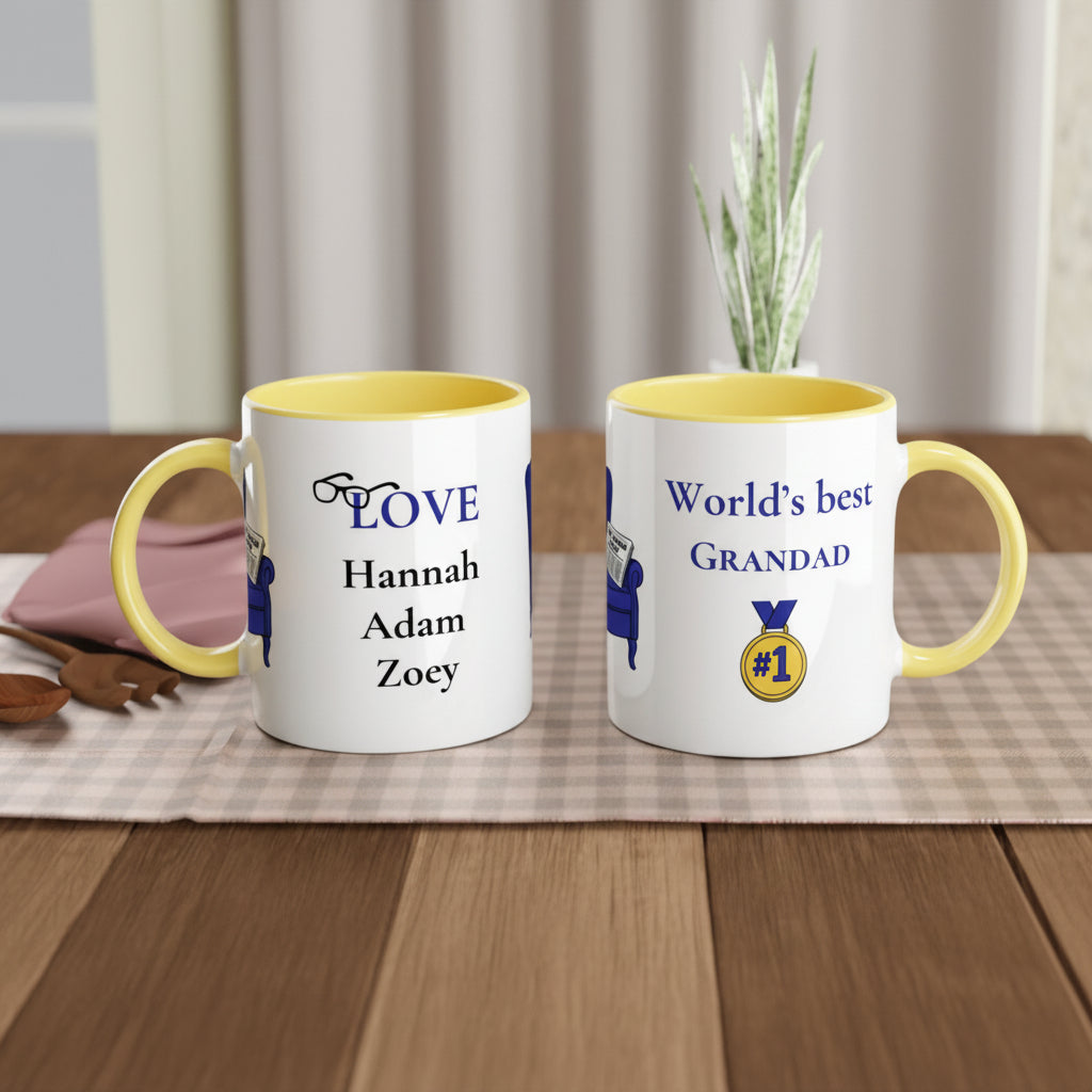 Two white ceramic mugs with yellow interiors and handles are shown on a wooden table. One mug is printed with the word 'LOVE' and names Hannah, Adam, and Zoey in blue.