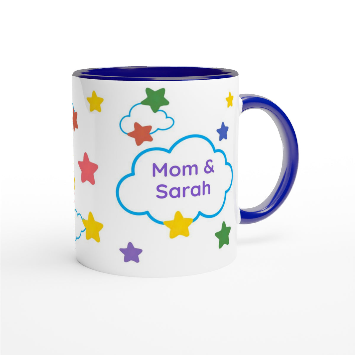 A white ceramic mug with a dark blue interior, handle, and rim, decorated with colorful stars and a blue cloud outline containing the text 'Mom & Sarah'.
