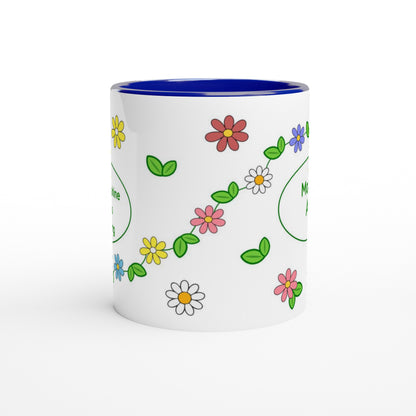 A white ceramic mug with a vibrant blue interior, decorated with a colorful pattern of daisies, flowers, and green leaves, shown on a clean white background.