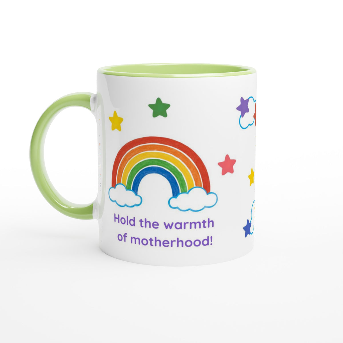 A white ceramic mug with a light green handle and interior, decorated with a colorful rainbow, stars, clouds, and the text 'Hold the warmth of motherhood!' in purple.