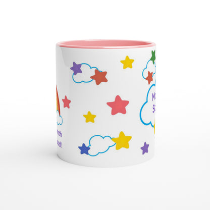 A white ceramic mug with a pink interior and exterior star-and-cloud pattern, shown on a clean white background.