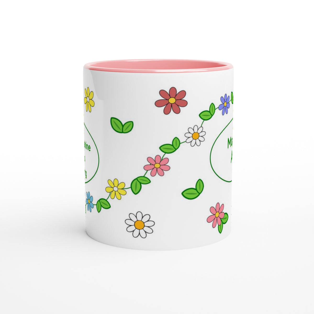 A white ceramic mug with a pink interior, decorated with a colorful pattern of cartoon-style flowers and green leaves.