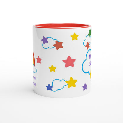 A white ceramic mug with a red interior, decorated with colorful cartoon stars and clouds, on a clean white background.