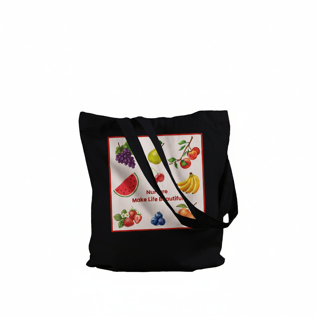 A black canvas tote bag with long shoulder straps, featuring a square graphic print on the front. The print showcases a colorful assortment of fresh fruits, including watermelon, grapes, bananas, strawberries, and blueberries, with the text 'Nature is Make Life Beautiful' written in red.