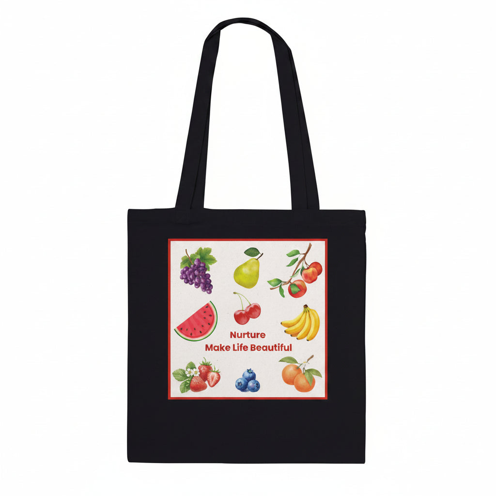 A black canvas tote bag with two shoulder straps, featuring a square graphic print on the front. The print showcases various colorful fruits, including watermelon, grapes, pears, cherries, bananas, strawberries, blueberries, and oranges, arranged around the text 'Nurture Make Life Beautiful'.