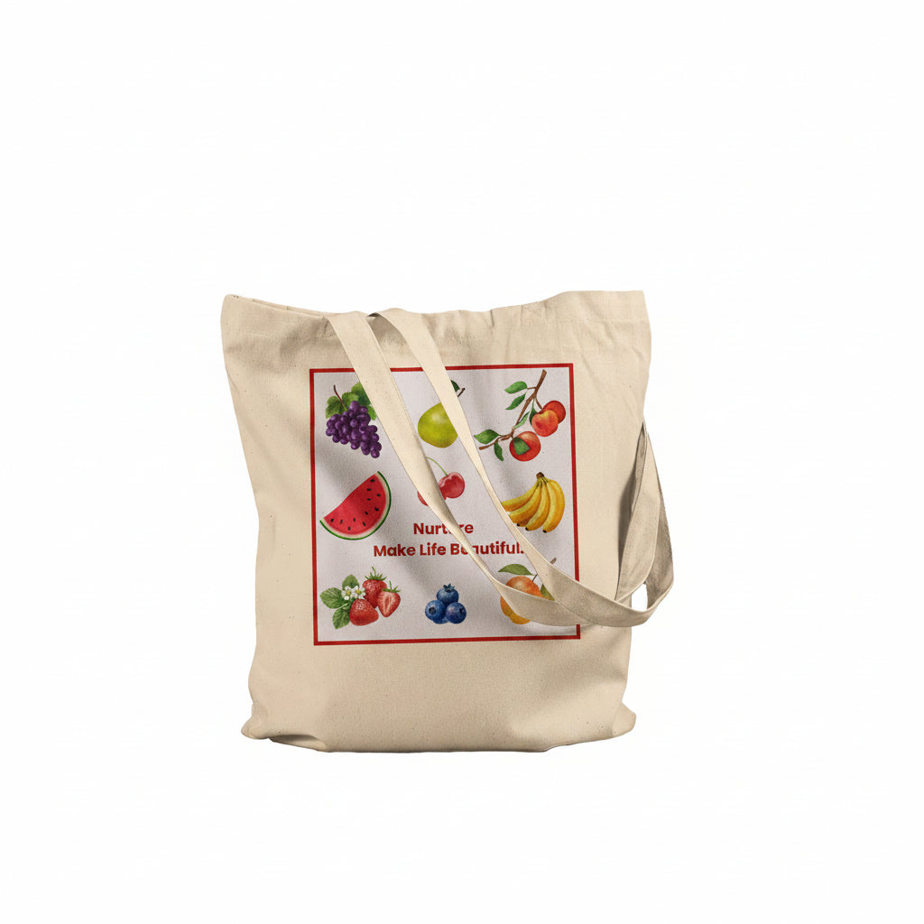A beige canvas tote bag with a colorful fruit-themed graphic print on the front, featuring illustrations of watermelon, grapes, apple, banana, strawberries, blueberries, and cherries with the text 'Nurture Make Life Beautiful.