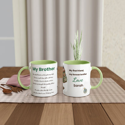 Two personalized ceramic mugs with light green handles and interiors, displayed side by side on a wooden table with a checkered placemat. One mug is printed with a poem titled 'My Brother' and the other with a poem titled 'My first friend, my forever brother' with 'Love Sarah' 