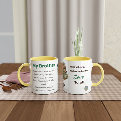 Two personalized ceramic mugs with yellow interiors and handles, displayed side by side on a wooden table with a placemat, spoon, and small plant in the background. One mug shows a poem titled 'My Brother' and the other shows a message starting 'My first friend, my forever brother Love Sarah'.