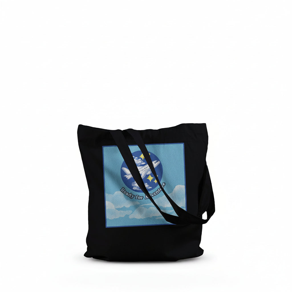 A black canvas tote bag with black shoulder straps, featuring a square graphic print on the front 